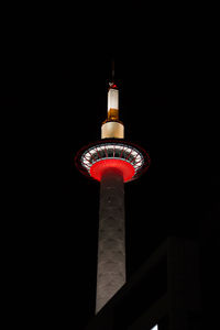 Low angle view of illuminated building against sky at night