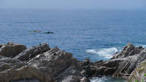 People having a trip on a kayak on ligurian sea in genova nervi, liguria, italy.