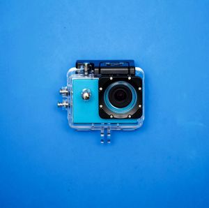 Camera against blue background