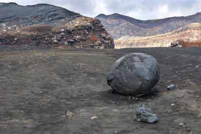 Rock on land against sky