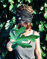 Rasta woman with leaves