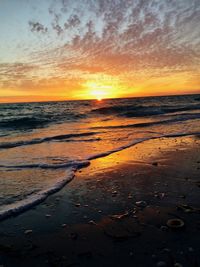 Scenic view of beach against sky during sunset