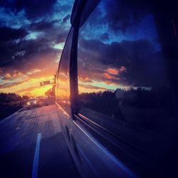 Road against cloudy sky at sunset