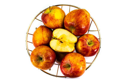 High angle view of apples in basket against white background