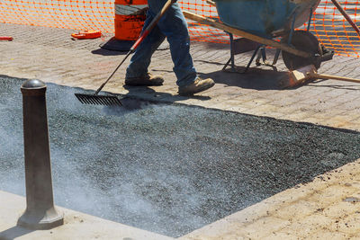 Low section of man working at construction site