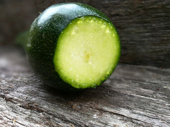 Close-up of wet lemon on table