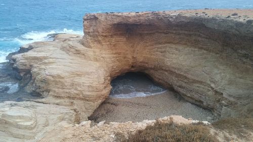 High angle view of rock formation in sea