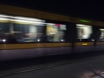 Blurred motion of train at railroad station platform