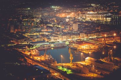 High angle view of illuminated buildings in city at night