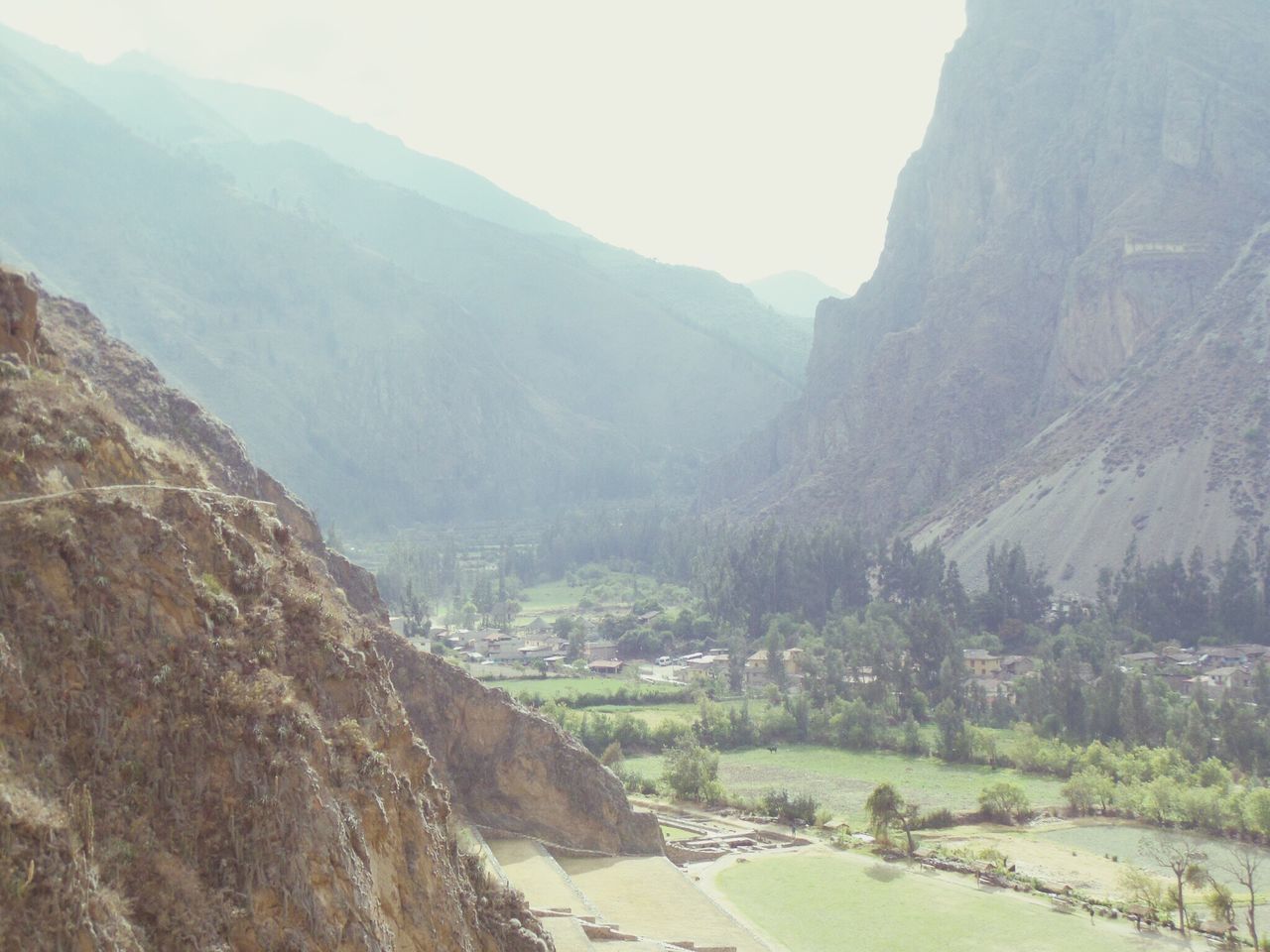 mountain, mountain range, tranquil scene, scenics, tranquility, beauty in nature, landscape, nature, non-urban scene, tree, valley, idyllic, sky, remote, day, green color, water, outdoors, clear sky, river