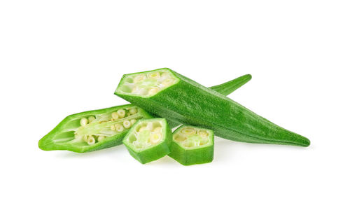 Close-up of green pepper against white background