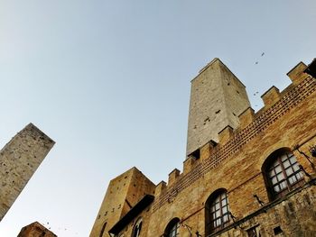Low angle view of buildings against clear sky