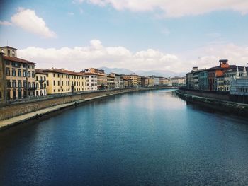 View of river in city against sky