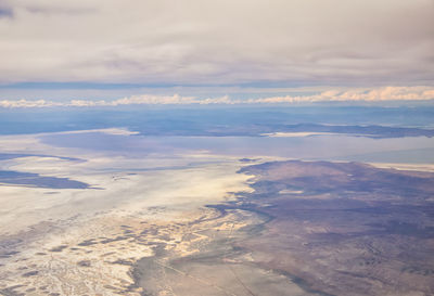 Aerial view from airplane of the great salt lake in rocky mountain range in utah, united states.