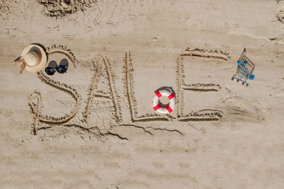 High angle view of people on sand at beach