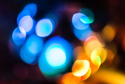 Defocused image of illuminated lights at night