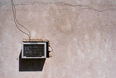 Close-up of electric lamp on wall