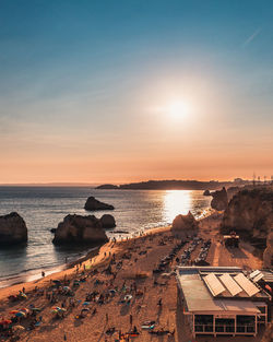 High angle view of sea against sky during sunset