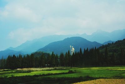 Scenic view of landscape and mountains against sky