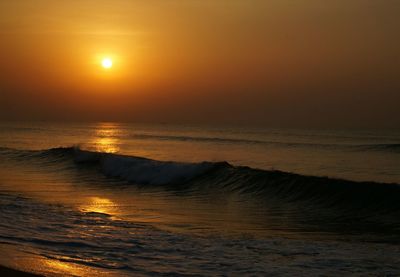 Scenic view of sea against sky at sunset