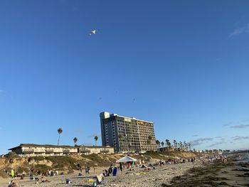 Low angle view of buildings against blue sky