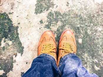 Low section of man standing on floor