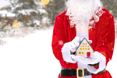 Rear view of woman holding gift