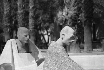 Statue of buddha against trees