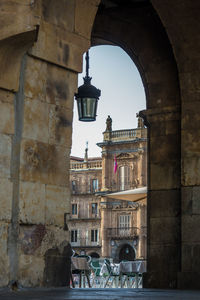 Street light against old building in city