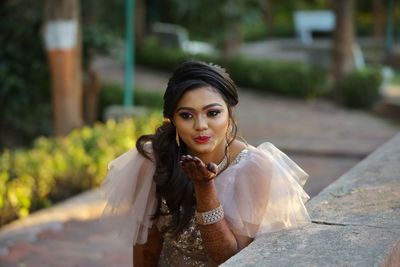 Portrait of young woman outdoors