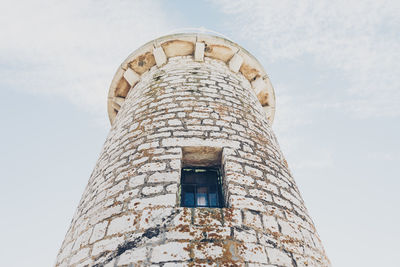 Low angle view of old building against sky