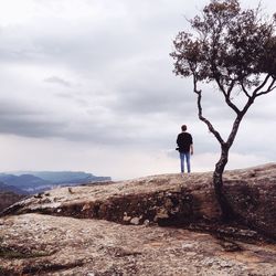 Full length of woman standing on landscape
