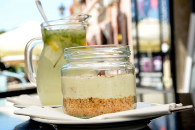 Close-up of drink in glass jar on table