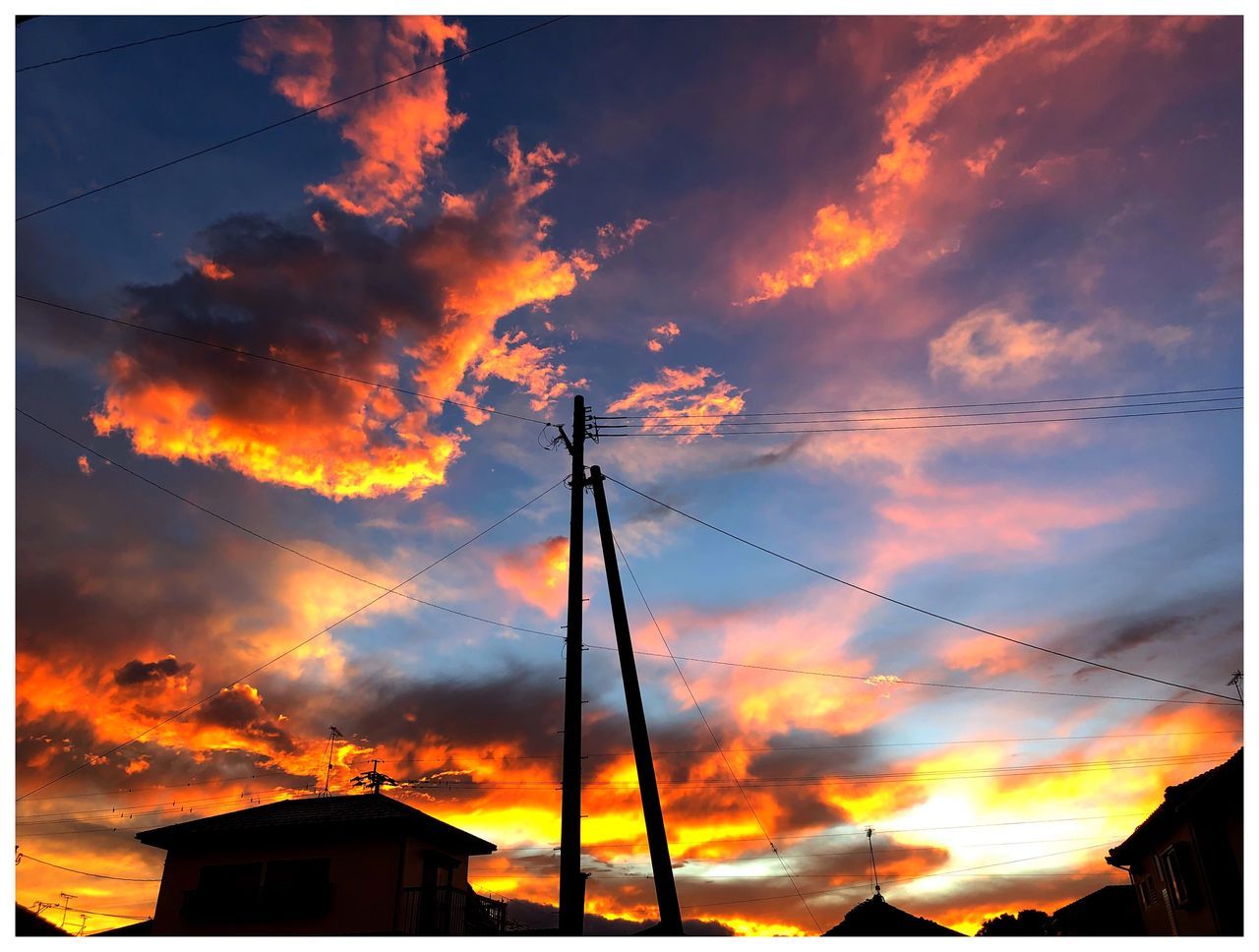 cloud - sky, sky, sunset, orange color, built structure, architecture, building exterior, no people, transfer print, nature, auto post production filter, silhouette, building, dramatic sky, low angle view, beauty in nature, scenics - nature, outdoors, house, power line, power supply, romantic sky