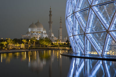Shiekh zayed grand mosque, featuring  the glass domes of the underground visiter center entrance