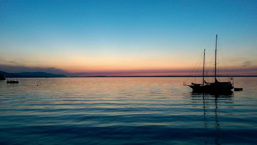 Scenic view of sea against sky at sunset