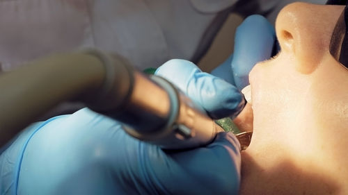 Dentist examining patient