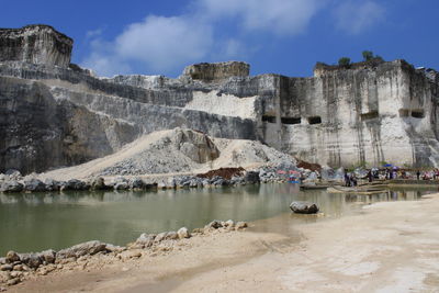 Scenic view of mountain against cloudy sky