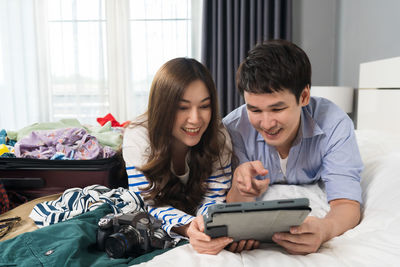 Young woman using laptop at home