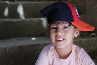 Portrait of smiling girl in cap