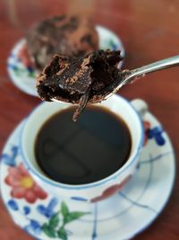 Close-up of coffee cup on table