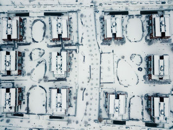 Aerial view of snow covered buildings in city