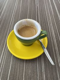 High angle view of coffee cup on table