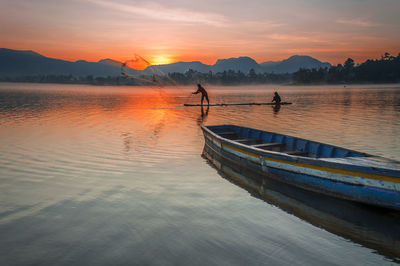 Scenic view of lake against sky during sunset