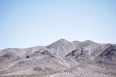 View of mountain range against clear sky