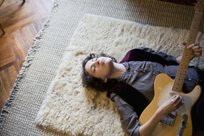 Young woman playing a guitar