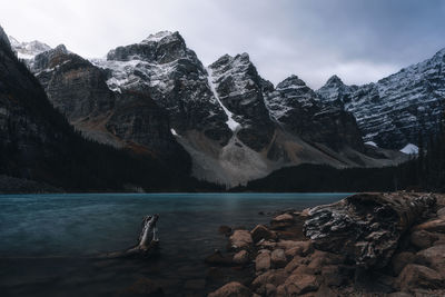 Scenic view of sea and mountains against sky