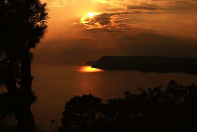 Scenic view of sea against sky during sunset