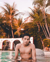 Portrait of young man in swimming pool