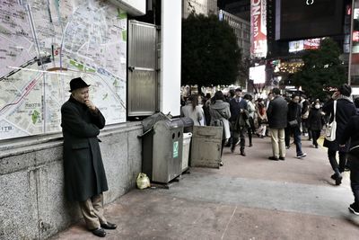 Woman standing in city